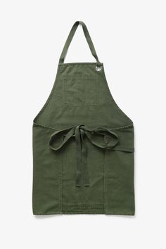 an apron that is green with a bow on the front