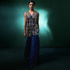 Wide Leg Indo Western Jumpsuit with Heavy Embroidery - A Unique Party Wear Indo Western Dress for Cocktail Parties, Weddings, and Sangeet Celebrations. Elevate your style with our Wide Leg Indo Western Jumpsuit, a perfect blend of contemporary elegance and traditional charm. The heavy embroidery detailing adds a touch of opulence, making it an ideal choice for weddings, cocktail parties, and special occasions. This unique party wear Indo Western dress showcases the latest design trends, providin Traditional Dresses For Wedding Guest With Resham Embroidery, Traditional Dresses With Resham Embroidery For Wedding Guest, Formal Sharara With Floral Embroidery, Embroidered V-neck Sets For Reception, Sleeveless Resham Embroidered Fabric For Wedding, Sleeveless Embroidered Fabric For Wedding, Sleeveless Wedding Fabric With Resham Embroidery, Fitted Sharara With Floral Embroidery For Party, Festive Party Wear Sets For Wedding Guests