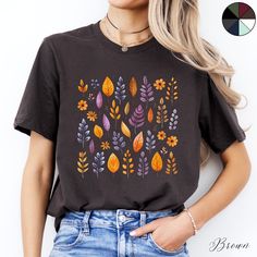 Autumn Leaves Unisex Boho Tee Shirt | Autumn Tshirt | Cottagecore Tee | Nature Clothing | Boho T Shirt ✔️ Soft, light and comfortable unisex short sleeve tee ✔️ 100% Airlume combed and ringspun cotton (fiber content may vary for different colours*) ✔️ Light fabric (4.2 oz/yd² (142 g/m ✔️ Retail fit 📏 Runs true to size ✔️ Dual side seams for structural support of the garment help hold its shape longer ✔️ Ribbed knit elastic collars to bolster shaping, twill taped shoulders to prevent stretching Forest Graphic, Leaf Shirt, Cottagecore Nature, Boho Tees, Limassol, Unisex Shorts, Twill Tape, Cotton Fiber, Solid Black