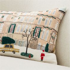 a pillow with a yellow taxi cab on it