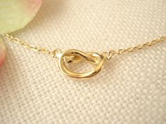 "This dainty knot eternity necklace is perfect for your everyday, birthday, best friends, Bridesmaid and someone special! * I ship in 1- 3 days in a gift box from California * Chain: Gold plated over brass, 16\" long (available 14\", 16\", 18\") * Knot Pendant: Gold, rose gold or silver plated over brass, 8 x 6 mm {Custom - Extra long Chain} If you would like a longer chain (20\" to 34\"), please add this in your cart after select any necklace length. https://www.etsy.com/listing/614040250/extra Modern Twist Infinity Necklaces As Gifts, Modern Twist Infinity Necklace For Gift, Modern Twist Infinity Necklace For Gifts, Modern Twist Infinity Necklace As Gift, Modern Infinity Necklace As Gift, Modern Gift Jewelry With Delicate Chain, Modern Twist Jewelry With Simple Design For Gift, Infinity Necklace With Delicate Chain For Wedding, Infinity Shaped Simple Wedding Jewelry