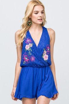 Leap into Summer in style with this floral embroidered romper by Entro clothing. Featuring a high waist surplice and ruffle detail, this little number is fun, flirty, and warm-weather-ready. If you’re looking for a lightweight garment to romp away the summer, you simply can’t go past this find. Available in royal blue or popping fuchsia, you’ll stand out from the crowd in this romper. The floral detailing just adds to the overall chic feeling of the outfit, ensuring you’ll turn heads wherever yo Flirty V-neck Jumpsuits And Rompers For Spring, Spring Beach Jumpsuits With Surplice Neckline, Beach Jumpsuits And Rompers With Surplice Neckline For Spring, Spring Party Jumpsuit With Surplice Neckline, Floral Embroidered Jumpsuits And Rompers For Summer Parties, Summer Party Jumpsuits And Rompers With Floral Embroidery, Embroidered Jumpsuits And Rompers For Summer Parties, Sleeveless Embroidered Jumpsuits And Rompers For Summer, Chic Ballet Flats