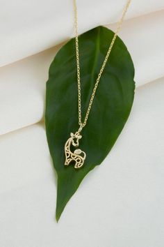 14k 18k 10k Solid Gold Diamond Giraffe Necklace Pendant, Minimalist Tiny Giraffe Charm Necklace, Animal Zoo Necklace Gift for Best Friend  FEATURES• Solid Gold (real gold, not gold plated or gold filled material)• Gold Karat: 10K (417) - 14K (585) - 18K (750) (optional)• Pendant Height: 0.57 Inches (1.44 cm)• Pendant Width: 0.37 Inches (0.93 cm)• Available Gold Color: Yellow gold, rose gold and white gold (optional)• Diamond weight: 0.005 ct  • Diamond color: G-H Color• Diamond clarity: SIWholes Gold Necklace With Animal Design For Gift, Gold Animal Design Necklace For Gift, Flamingo Necklace, Giraffe Necklace, Pendant Minimalist, Celestial Necklace, Gift For Best Friend, Pet Necklace, Diamond Fashion