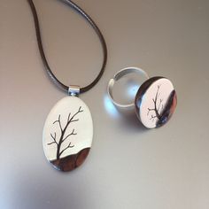 This  tree jewelry set consist of  a pendant and a ring. This wooden jewelry set is hand fabricated from cocobolo wood and sterling silver. These wood silver pendant ring  will be a great 5th anniversary gift for her or a lovely gift for any occasion.     - The wooden pendant weighs approx. 0.26 ounce (7.5 g)  - The tree ring  weighs   approx. 0.27 ounce (7.7 g)    This wood silver pendant is available in different lengths of brown cord.    This wood silver ring can be adjusted according to your finger size. Suitable for sizes US 7 to 9 . Please contact if you would need a different size. - You'll get the wooden jewelry set in a little box ready to give away.And also you can add a gift message during purchase. - No CNC or similar tools have been used, each pendant and ring are handmade. Pl Forest Jewelry, Tree Jewelry, Jewelry Nature, Aluminum Jewelry, Pendant Ring, Polymer Jewelry, 5th Anniversary, Jewelry Tree, Wooden Pendant