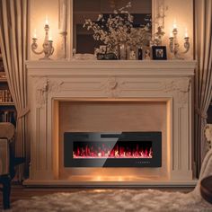 a living room with a fire place in the center and candles on the wall behind it