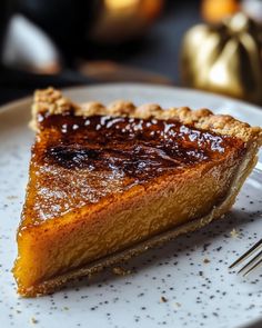 a piece of pie sitting on top of a white plate