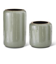 two green vases sitting next to each other