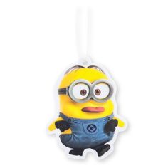 a yellow and black minion ornament hanging from a string on a white background