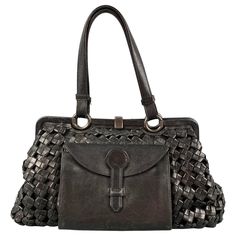 BOTTEGA VENETA 'Limited Edition' bag comes in a black woven leather featuring a satchel style, front pocket detail, top handles, inner pocket, and a top clasp closure. Made in Italy. Very Good Pre-Owned Condition. Marked: 13498 031/250 Measurements: Length: 13.5 inches Width: 7 inches Height: 8 inches Drop: 7 inches Reference: 119102 Category: Handbag & Leather Goods More Details Brand: BOTTEGA VENETA Gender: Female Color: Black Pattern: Woven Fabric: Leather Style Bag: Satchel Age Group: Adult Made in: Italy Limited Edition Bag, Leather Satchel Handbags, Satchel Handbag, Satchel Handbags, Black Pattern, Pocket Detail, Leather Satchel, Fashion Handbags, Leather Fashion