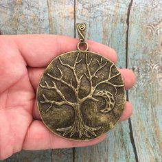 You will receive 3 - Bronze Tree Pendant in a Disk by TIJC! These charms are a quality Pewter for all your jewelry and crafting projects! - (3) Bronze Tree Charm - 84x64x11mm ( 25.4mm = 1 inch ) - Quality Pewter - Item # SP1467B Use to Make Tree of Life Necklace Tree of Life Jewelry Tree of Life Pendant All Items will come as shown in a poly bag! Etched Jewelry, Tree Charms, Diy Jewelry To Sell, Necklace Tree, Tree Of Life Jewelry, Gold Cross Pendant, Clay Jewelry Diy, Tree Necklace, Tree Of Life Necklace