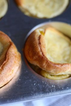 several baked pastries sitting in a muffin tin