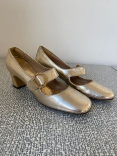 Vintage 1960's Mod Gold Pumps -  Size 5.5 - Gold, square heels with buckle, 1960's era - so mod! - Heel is a little over an inch - Okay vintage condition - a little wear at toes, scuffs & ding on heels Retro Square Toe Party Heels, Retro Square Toe Heels For Party, Retro Square Toe Heels For Evening, Vintage High Heel Court Shoes For Spring, Retro High Heels For Vintage Fashion, Retro Almond Toe Heels Medium Width, Retro High Heel Heels For Vintage Fashion, Retro Heels With Pointed Toe For Vintage Fashion, Retro Round Toe Evening Heels