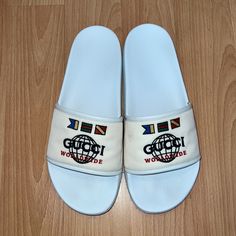 Men’s Gucci Slide Sandals Size: Uk 11 / Us 12 (Fits True To Size) Color: Cream/White Description: Molded Footbed, Open Toe, Slip On, Flag And Logo Embellishment At Strap Material: Nylon Upper And Lining, Rubber Sole (Made In Italy) Gently Used, Signs Of Wear On Bottom Of Sole (See Pictures) Gucci Slide, Gucci Shoes, Flip Flop Sandals, Slide Sandals, Open Toe, Shoes Sandals, Shoes Mens, Men's Shoes, Slip On