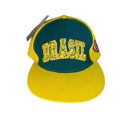 Vintage Brasil Snapback Hat Yellow Green Baseball Cap Spellout Embroidery Brazil World Cup Soccer Football National Good condition with a little fuzziness from storage but new with tags & no major holes, stains or damage. Please see photos. Thanks! Yellow Snapback Hat With Embroidered Logo, Yellow Embroidered Snapback Hat, Green Baseball Cap, Brazil World Cup, Soccer Football, Snapback Hat, Snapback Hats, World Cup, Baseball Cap