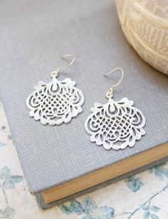 Silver Filigree Earrings Bridal Accessories by apocketofposies Elegant Laser Cut Jewelry As A Gift, Elegant Laser Cut Jewelry For Gifts, Elegant Laser Cut Jewelry Gift, Ornate White Filigree Earrings, White Metal Filigree Earrings, White Filigree Metal Earrings, Delicate Silver Chandelier Earrings As Gift, Silver Laser Cut Earrings As Gift, Silver Metal Chandelier Earrings With Filigree