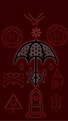 an umbrella with various symbols on it in the dark night time, and red background