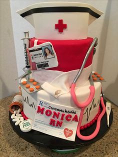 a cake made to look like a nurse's hat with medical supplies on top