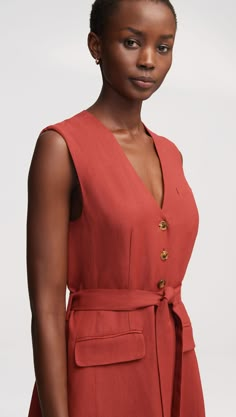 This easy, elevated midi dress in a lightweight linen twill makes for an effortless transition from spring to summer. Featuring besom pockets and an adjustable belt, the all-occasion dress is designed with vest details and a center-front button closure. Chic Belted Linen Dress For Work, Elegant V-neck Linen Dress With Pockets, Elegant Belted Linen Dress For Work, Summer Linen Belted Dress For Work, Belted Linen Midi Dress For Day Out, Belted Midi Linen Dress For Work, Chic Linen Belted Midi Dress, Chic Belted Linen Dress, Formal Linen Belted Dress