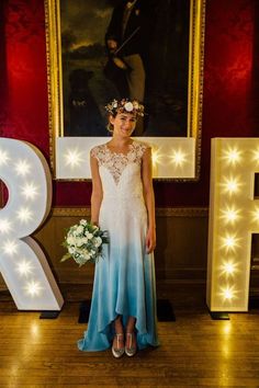 a woman standing in front of the letter r