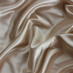 "Stretch Charmeuse Light Champagne, Silk by Yard, Silk Satin fabric, Luxurious Poly Silk for Gowns, Dress, Tapioca Silk for Bridesmaids, Our charmeuse satin is a wondrous fabric, it's shiny, silky, and soft, it moves like water - the drape is out of this world! This makes it perfect for items worn against the skin - luxurious gowns, bridal dresses, chemises, lingerie, camisoles, and robes, slinky evening wear, and silky covers. Whatever you make, it will be sure to be a sumptuous piece in your w Champagne Satin Wedding Dress, Champagne Colour Aesthetic, Luxury Silk Modal Satin Dress For Women, Silk Champagne Dress, Satin Champagne Dress, Luxury Dress Aesthetic, Champagne Colour, Shiny Dress, Silk Aesthetic