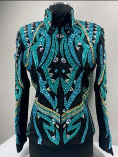 the back of a jacket with blue and gold sequins, on a mannequin's head