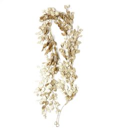 a white and gold necklace with leaves on it