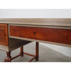 an old desk with two drawers on one side and a drawer at the other end