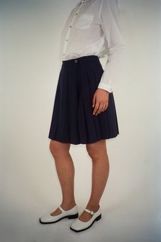 Pleated Short Skort For Work, Short Length Relaxed Skort For Workwear, Preppy Short Skirt For Workwear, Pleated Mini Skirt For Work, Lined Mini Skirt For Work, Navy Skirt For Summer Workwear, Preppy Fitted Short Length Skort, Classic Mini Skort, Classic Short Length Skort For Workwear