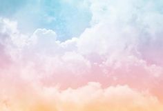 the sky is filled with fluffy clouds in pastel colors