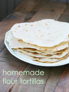 homemade flour tortillas on a white plate