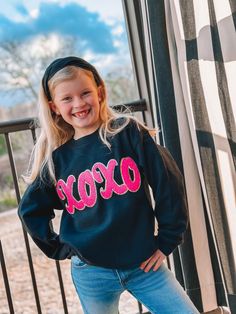 Look how CUTE! This hot pink XOXO chenille pops on this black sweatshirt! The amazing thing about this sweatshirt is that it is available from 2T - Adult 3XL!! Match with your little ones this Valentine's Day with this adorable sweatshirt! You will definitely get compliments! This is one of our favorites! Unisex sizing and fit Size: 2T - Adult 3XL SPECIAL CARE - WASHING INSTRUCTIONS: Hand washing and air drying are always best for these items. Wash on delicate, cold, and inside out. Always air d Cute Black Winter Sweatshirt, Cute Black Sweatshirt For Winter, Cute Black Crew Neck Sweater, Cute Black Sweatshirt With Letter Print, Cute Black Sweatshirt For Fall, Cute Black Fall Sweatshirt, Black Sweatshirt, Washing Instructions, Hand Washing