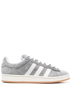 Campus 00s low-top sneakers from adidas featuring light grey, calf suede, signature 3-Stripes logo, logo-print tongue, round toe, front lace-up fastening, branded insole and flat rubber sole. Gray Campus 00s, Adidas Gray High-top Sneakers, Gray Adidas Campus, Gray Adidas Sneakers With Logo, Adidas Campus 00s Grey, Campus 00s Grey, Gray Adidas Lace-up Sneakers With Logo, Adidas Campus 00s, Adidas Campus