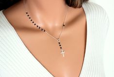 "Gorgeous .925 Sterling Silver Rosary inspired necklace with Black Austrian Crystals. Inspired by Yolanda Foster of \"The Real Housewives of Beverly Hills\" this necklace can be ordered in a 16\", 18\", 20\" or 22\" length and has a 2 1/4\" drop with a 19x11mm plain cross pendant. The cross on this necklace has changed please see last photo to see the crust that you will be receiving when you order this necklace. (The length is the measurement around the neck only). Comes beautifully boxed, the Black Crucifix Jewelry For Jewelry Making, Spiritual Black Lariat Necklace, Black Sterling Silver Crucifix Jewelry, Elegant Rosary With Adjustable Chain, Elegant Black Cross Necklace Gift, Black Sterling Silver Cross Necklace For Gift, Black Lariat Necklace For Gift, Black Lariat Necklace As Gift, Elegant Black Crucifix Jewelry