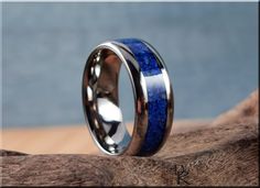 This is a beautiful, handcrafted Artisan ring made in my small shop in Ottawa, Ontario, in Canada. This beautiful ring holds a stunning Lapis Lazuli stone inlay on a titanium comfort fit core. US full and half ring sizes from 5 - 13 are available, in widths of 4mm, 6mm, and 8mm. If you require a custom order at a different size, please send me a message and I will do my best to accommodate.  NOTES: Shown in 8mm comfort fit width. A luxurious, solid Walnut box with logo is available as a presenta Artisan Promise Ring, Round Rings With Inlay Perfect For Gifts, Gift Round Ring With Inlay, Gift Open Ring With Inlay, Channel Ring, Printable Ring Sizer, Lapis Ring, Ottawa Ontario, Artisan Rings