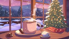 a cup of coffee sitting on top of a wooden table next to a christmas tree