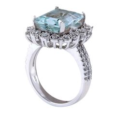 Stamped: 14K White Gold Total Ring Weight: 8.0 Grams Gemstone Weight: Total Natural Aquamarine Weight is 4.88 Carat (Measures: 12.05x10.00 mm) Color: Blue Diamond Weight: Total Natural Diamond Weight is 0.70 Carat Quantity: 56 Color: F-G, Clarity: VS2-SI1 Face Measures: 19.65x17.90mm Sku: [702085W] 14k White Gold Diamond Ring, White Gold Diamond Rings, Aquamarine Blue, Natural Aquamarine, Blue Diamond, Aquamarine, White Gold Diamonds, Natural Diamonds, Diamond Ring