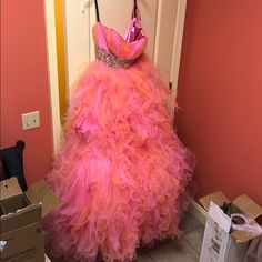 Pink Gown For Pageant During Prom Season, Pink Strapless Prom Gown, Pink Strapless Tulle Gown, Pink Strapless Ball Gown For Prom Season, Pink Pageant Dress For Prom Season, Strapless Pink Gown For Debutante Ball, Pink Dress For Prom Season Pageant, Pink Dress For Pageant And Prom Season, Pink Floor-length Evening Dress For Quinceanera