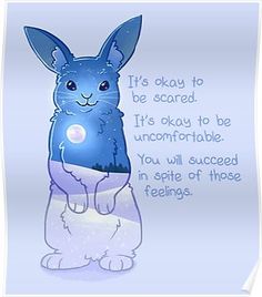 a blue rabbit sitting in front of a quote