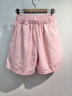 "Women's Organic Linen Cotton Water Color Tone Soft Daily Shorts for Summer Natural Loose fit Banding waist and mid waist Size One size, good for US 4-12 with loose fit Length 41cm / 17\" Waist width 30cm /12\" Inseam 18cm /7\" Fabric and Care Organic Linen 60% Organic Cotton 40% Machine washable and tumble dry Made in S Korea" Summer Pants With Elastic Waistband In Pink, Summer Pink Pants With Elastic Waistband, Pink Summer Pants With Elastic Waistband, Spring Pink Shorts, Casual Pink Bottoms With Pockets, Pink Cotton Bottoms Solid Color, Pink Cotton Bottoms, Casual Pink Bottoms For Spring, Pink Shorts With Pockets For Loungewear