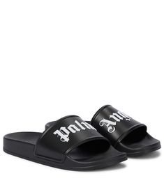 Show street-style savvy by the pool with these black slides from Palm Angels, which feature the label's gothic-stylised logo in contrasting white. This lightweight PVC pair has supportive wide straps and a cushioned feel to the soles, making them perfectly comfortable for strolls in the sun. | Palm Angels Logo slides Casual Open Toe Slides With Logo Print, Summer Slide Sandals With Logo Print, Open Toe Slides For Spring Streetwear, Trendy Open Toe Slides For Streetwear, Black Slides For Streetwear In Spring, Trendy Slides For Summer Streetwear, Trendy Summer Slides For Streetwear, Black Slides For Spring Streetwear, Trendy Streetwear Slides For Spring