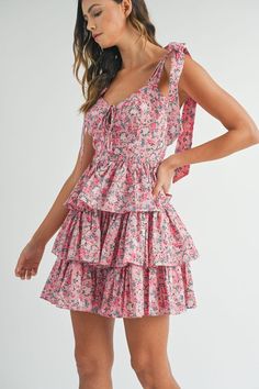 Flaunt your style in the Pierce Floral Corset Ruffle Mini Dress. This charming dress features adjustable shoulder straps that tie into a playful bow, a flattering corset detail, and cascading ruffles. The elastic ruching back ensures a perfect fit. Perfect for a fun and flirty look! (Bow-tiful style - No wonder it's tied up in a bow!) Mini Dress Pink, Draped Midi Dresses, Floral Corset, Cascading Ruffles, Sorority Recruitment, Ruffle Mini Dress, Arte Popular, Pink Mini Dresses, Dress Pink