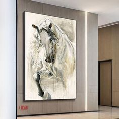 a large white horse is in the middle of a room with beige walls and flooring