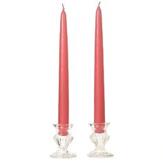 two red candles sitting next to each other