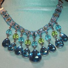 Nwtags: Aqua Blue Teardrop Necklace, Has Lime Green Beads And Rhinestones Around The Top, 18" Chain, 3" Teardrops In The Middle, Has A Row Of Round Small Rhinestones Up On The Top Of The Necklace, Blue Crystal Beaded Necklaces For Party, Blue Crystal Beaded Necklace For Party, Elegant Blue Beaded Necklaces With Gemstone Accents, Elegant Blue Beaded Necklace With Gemstone Accents, Blue Beaded Dangle Crystal Necklaces, Blue Beaded Dangle Crystal Necklace, Blue Teardrop Pendant Jewelry For Party, Blue Dangle Necklaces For Party, Elegant Blue Crystal Necklace With Gemstone Accents