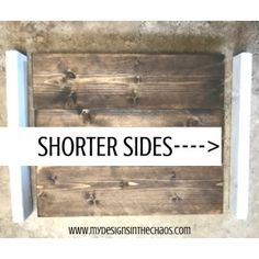 a wooden sign that says shorter sides with the words above it and below it is an arrow