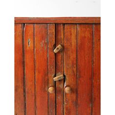 an old wooden cabinet with knobs and handles