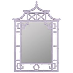 a mirror that is sitting on top of a table with a light purple frame around it