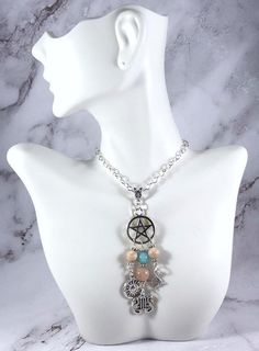 This beautiful chain necklace is the perfect way to express your affinity for Apollo.Pendant is made with four charms:PentacleSunLyreBow & Arrow3 genuine sunstone beads and one amazonite bead also make up the pendant.Available in a variety of lengths. Secured with a lobster clasp that can fit in any of the links on the chain, making it easily adjustable.Metal is zinc alloy and beads are natural gemstone. All materials are lead and nickel free.Comes in a jewelry box so it’s ready to be given Spiritual Charm Necklaces With Dangling Charms, Spiritual Silver Charm Necklaces With Gemstone Beads, Spiritual Dangle Charm Necklace With Adjustable Chain, Greek Mythology Jewelry, Mythology Jewelry, Chain Making, Pagan Witch, Roman Mythology, Bow Arrows