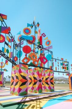 an art installation is shown in the middle of a colorful area with lots of different shapes and sizes