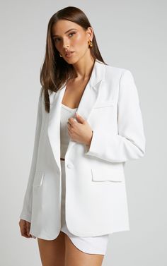 White Blazer With Buttoned Pockets For Spring, White Structured Blazer With Button Closure, Spring Office Blazer With Buttoned Pockets, Elegant Spring Blazer With Buttoned Pockets, Chic Blazer With Buttoned Pockets, Office Blazer With Notch Lapel And Buttoned Pockets, Sleek Spring Blazer With Pockets, Sleek Spring Blazer With Button Closure, Sleek Blazer With Pockets For Spring